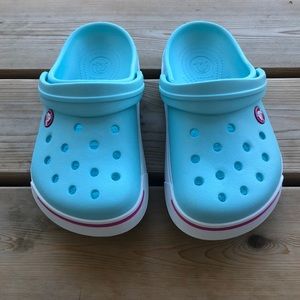 Crocs J1 Aqua slides.